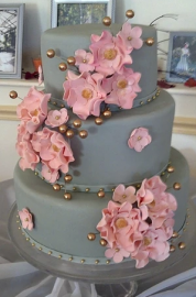 gray cake with pink flowers